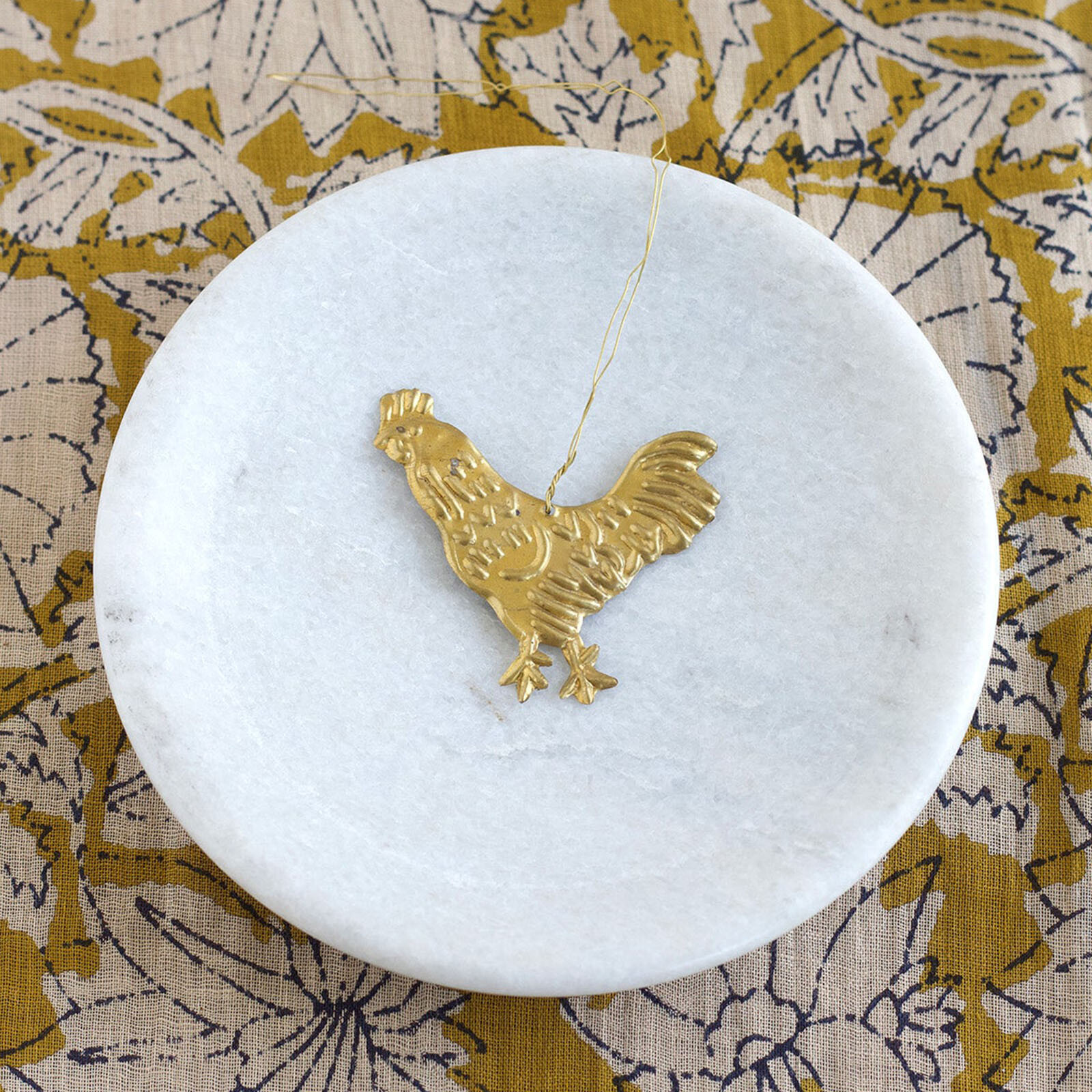 Handgemaakt ornament van De Weldaad – haan van messing